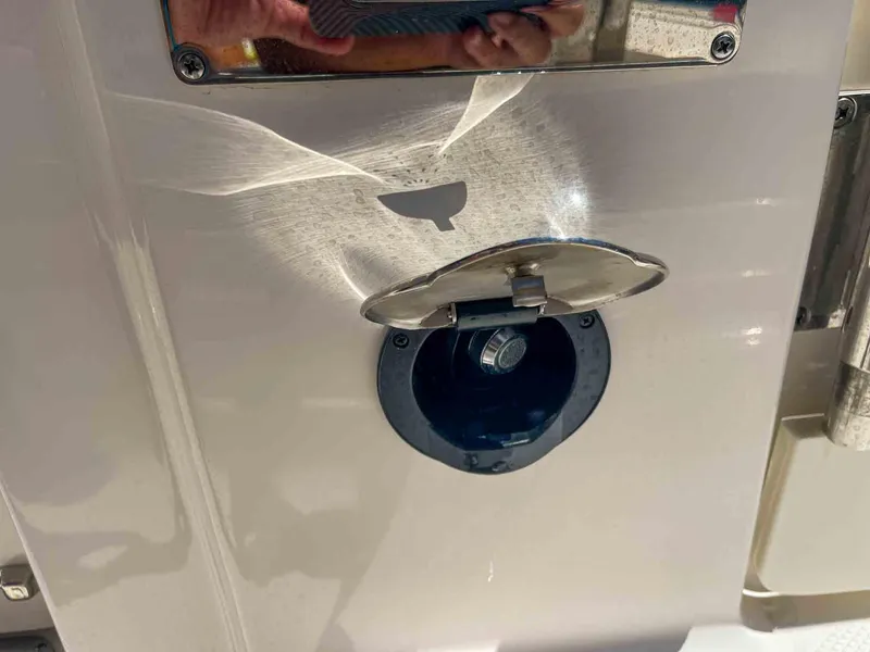 Slide: The Image of Fuel cap on a 2021 Chaparral 300 OSX boat. - 40