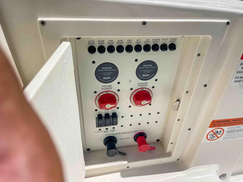 Slide: The Image of Control panel of 2021 Chaparral 300 OSX boat with switches and dials. - 41