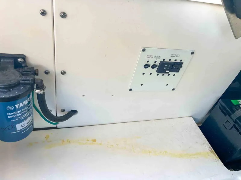 Slide: The Image of Control panel and Yamaha marine filter on 2021 Chaparral 300 OSX boat. - 44