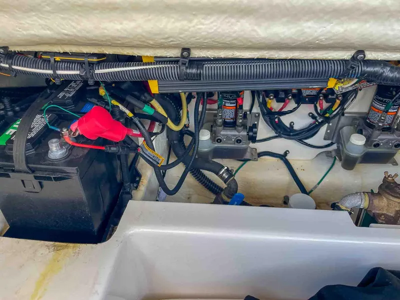 Slide: The Image of Engine compartment of 2021 Chaparral 300 OSX with battery and wiring. - 46