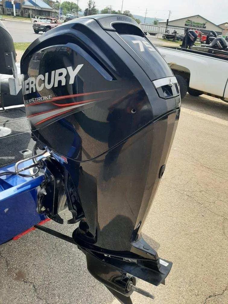 Slide: The Image of 2016 Bass Tracker 175TF with Mercury outboard motor, parked outdoors. - 3