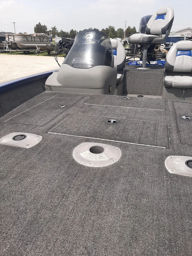 Slide: The Image of 2016 Bass Tracker 175TF boat interior with seating and storage compartments. - 4