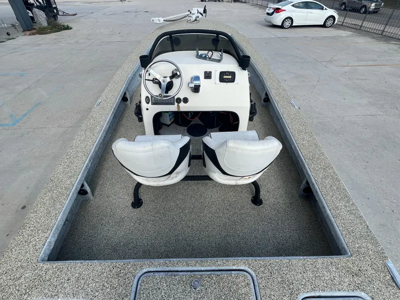 Slide: The Image of 2013 Haynie 24 HO boat interior with dual seats and steering console. - 8