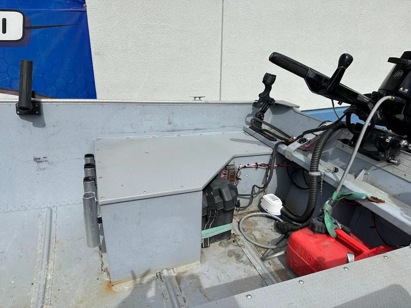 Slide: The Image of 2022 Lund WC-14 boat interior with steering controls and equipment. - 10