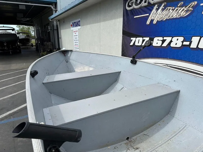 Slide: The Image of 2022 Lund WC-14 boat interior at a marine dealership. - 12