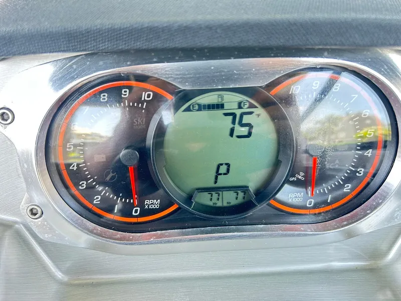 Slide: The Image of Dashboard of a 2016 Scarab 255 H.O. Platinum showing 75°F and RPM gauges. - 3