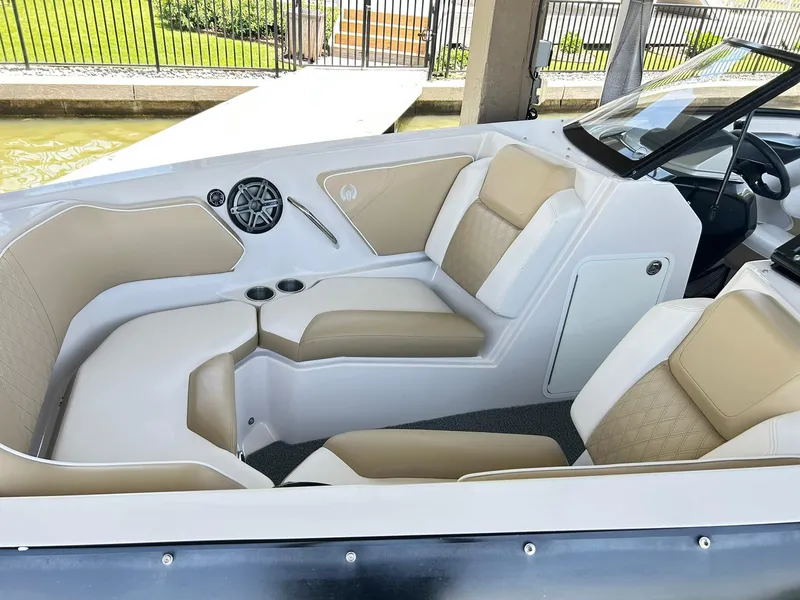 Slide: The Image of 2016 Scarab 255 H.O. Platinum boat interior with beige seating and speaker system. - 4