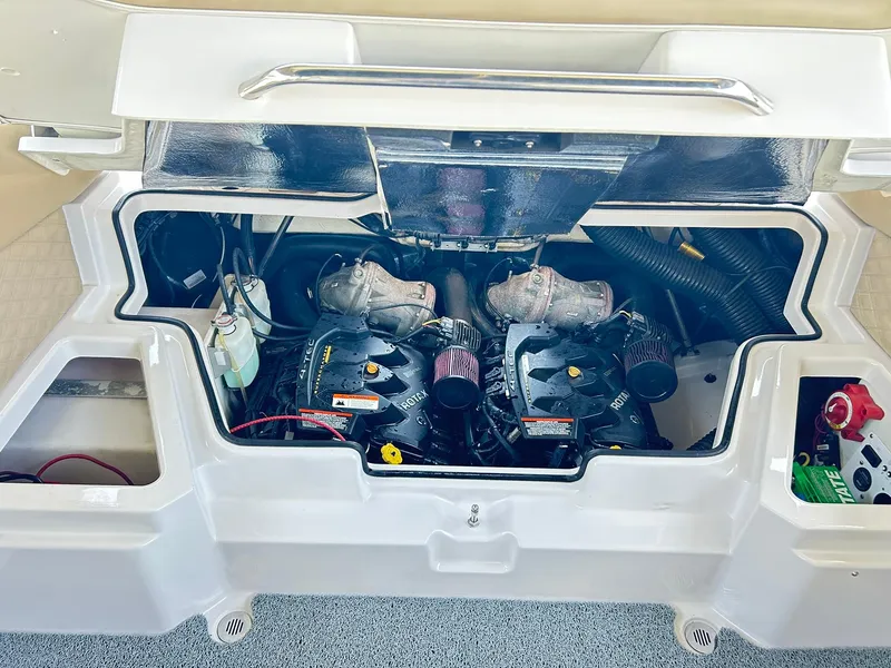 Slide: The Image of Engine compartment of a 2016 Scarab 255 H.O. Platinum boat, showcasing dual engines. - 40