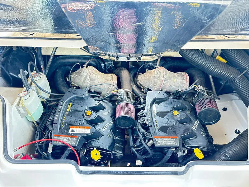 Slide: The Image of Engine compartment of a 2016 Scarab 255 H.O. Platinum boat, featuring dual Rotax engines. - 41