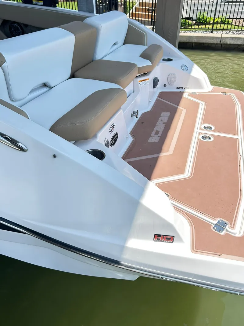 Slide: The Image of 2016 Scarab 255 H.O. Platinum boat with cushioned seating and swim platform. - 8