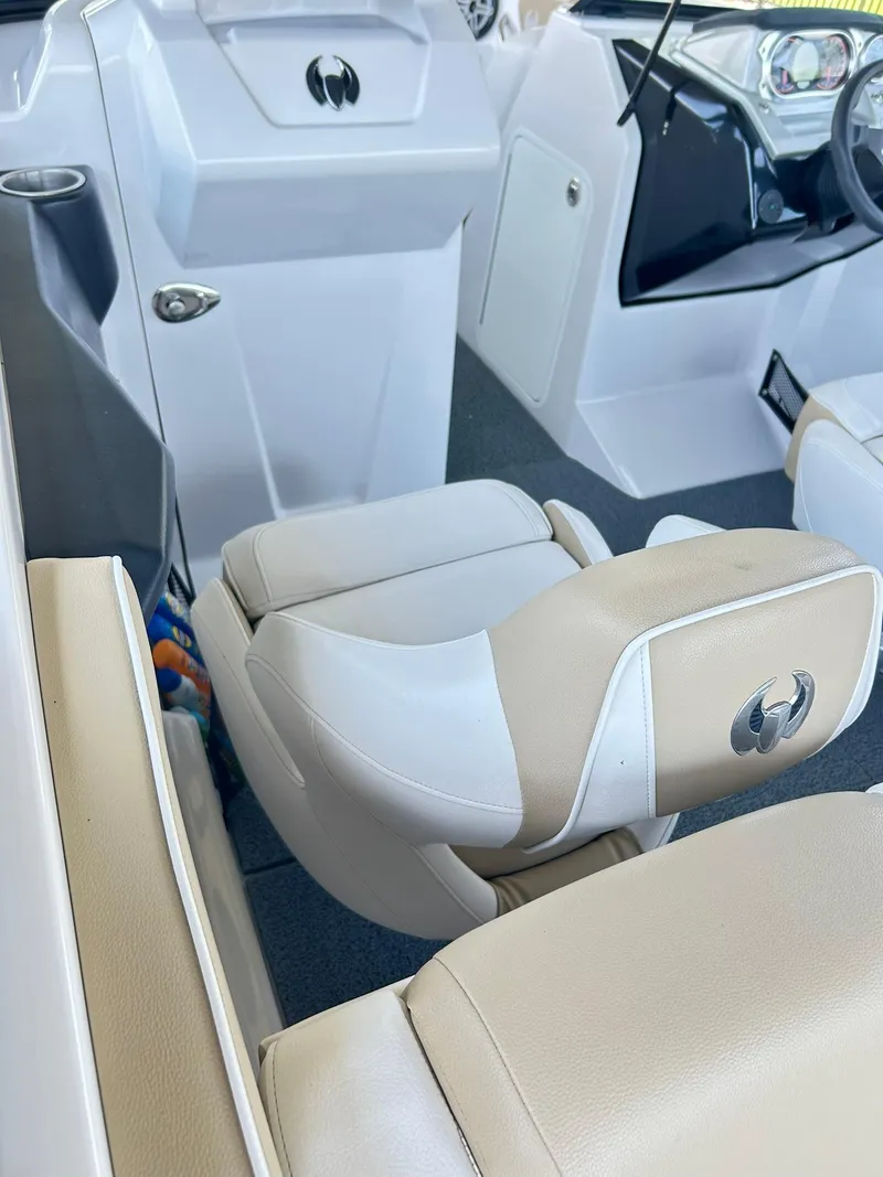 Slide: The Image of 2016 Scarab 255 H.O. Platinum boat interior with beige and white seating. - 9
