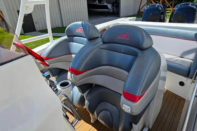 Slide: The Image of 2012 Cougar R10 Rigid Inflatable boat interior with stylish seating and red accents. - 16