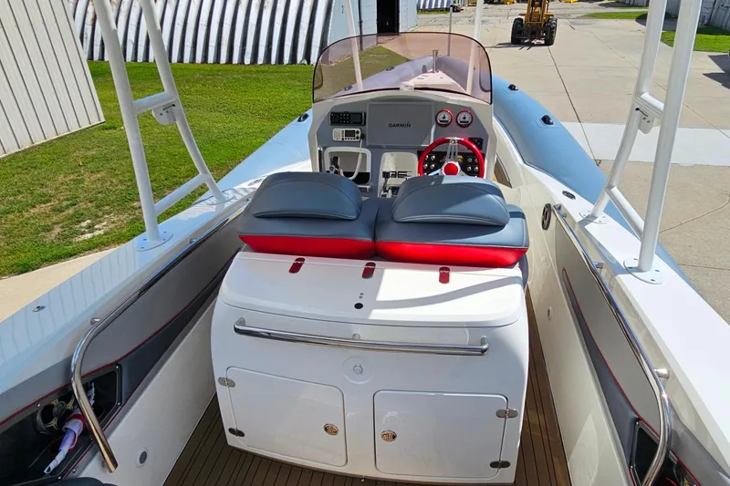 Slide: The Image of 2012 Cougar R10 Rigid Inflatable boat interior with modern dashboard and seating. - 24