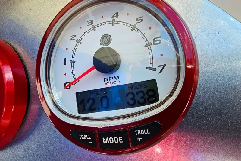 Slide: The Image of Close-up of Cougar R10 Rigid Inflatable 2012 tachometer displaying RPM, volts, and hours. - 29