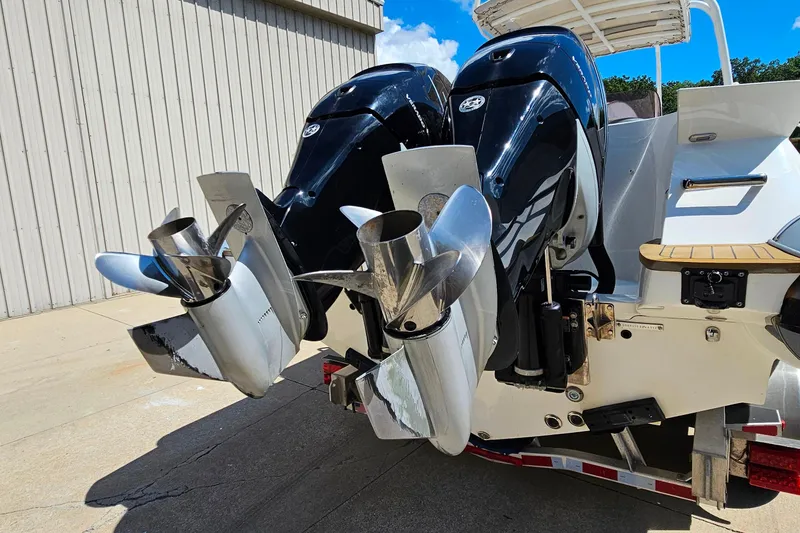 Slide: The Image of 2012 Cougar R10 Rigid Inflatable boat with dual outboard motors and stainless steel propellers. - 4