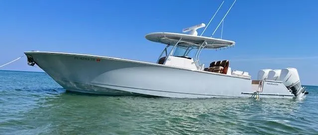 Slide: The Image of 2022 Valhalla Boatworks V-37 in calm waters, showcasing sleek design and powerful engines. - 1