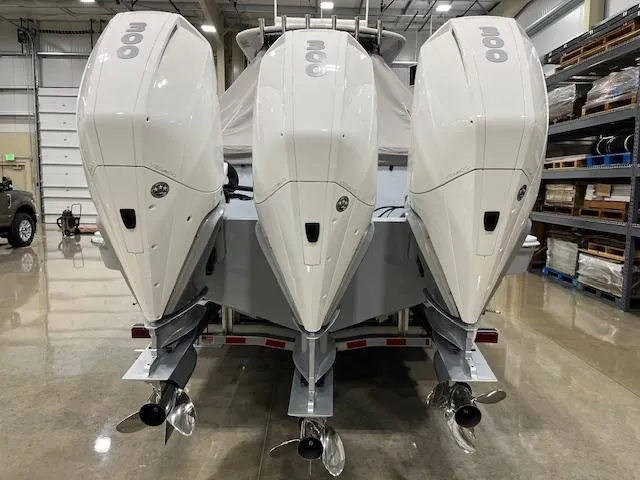 Slide: The Image of 2022 Valhalla Boatworks V 37 with triple outboard engines in a showroom. - 11