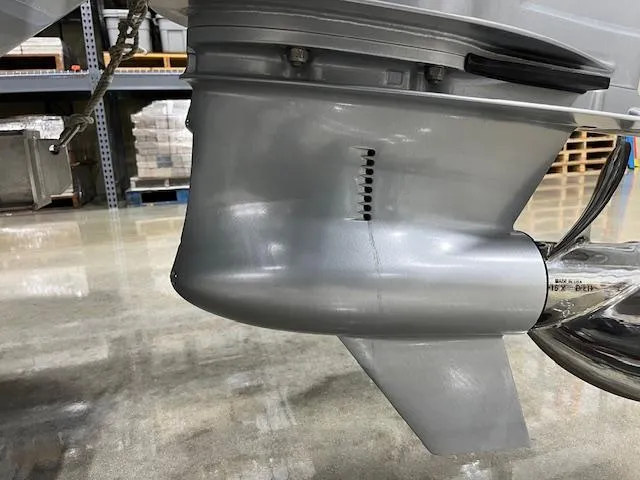 Slide: The Image of 2022 Valhalla Boatworks V 37 outboard motor detail in a workshop setting. - 16