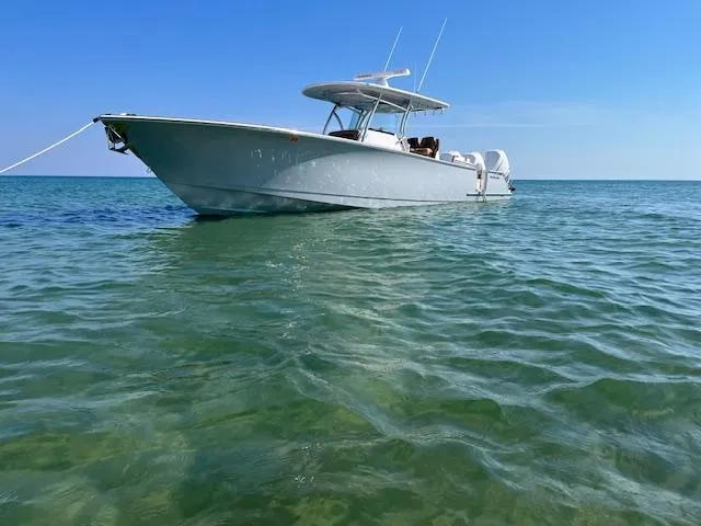 Slide: The Image of 2022 Valhalla Boatworks V-37 floating on clear blue water. - 2