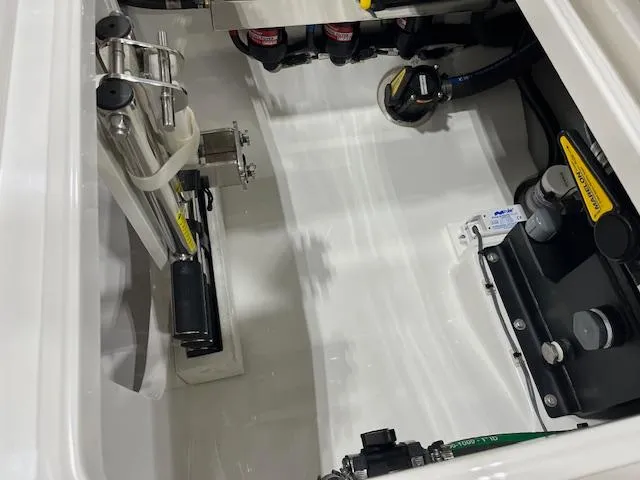 Slide: The Image of 2022 Valhalla Boatworks V 37 engine compartment with mechanical components and wiring. - 23