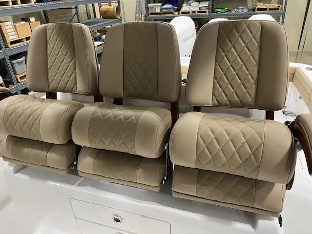 Slide: The Image of 2022 Valhalla Boatworks V 37 seats with beige diamond-stitched upholstery in a showroom. - 26