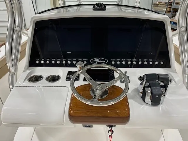 Slide: The Image of 2022 Valhalla Boatworks V 37 helm with steering wheel and control panel. - 27