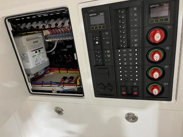 Slide: The Image of Electrical panel of 2022 Valhalla Boatworks V 37, showcasing wiring and control systems. - 34