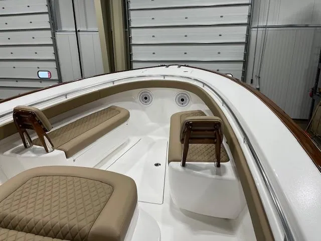 Slide: The Image of 2022 Valhalla Boatworks V 37 interior with tan seating and white deck. - 35