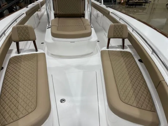 Slide: The Image of 2022 Valhalla Boatworks V 37 interior with tan quilted seating and white deck. - 36