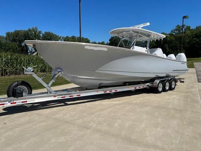 Slide: The Image of 2022 Valhalla Boatworks V 37 on trailer, parked outdoors under clear blue sky. - 7