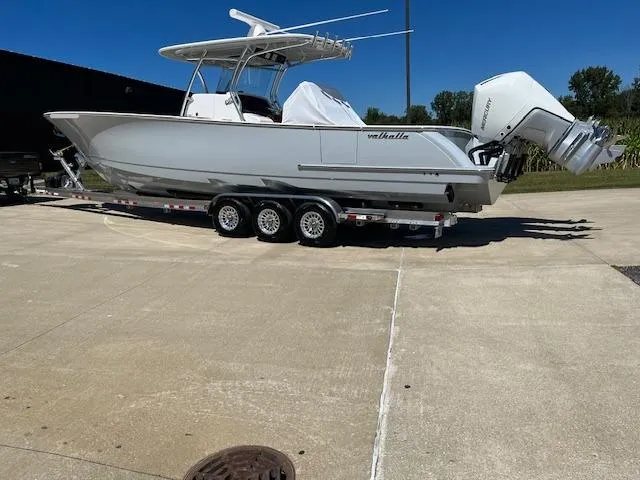 Slide: The Image of 2022 Valhalla Boatworks V 37 on a trailer, parked outdoors. - 9
