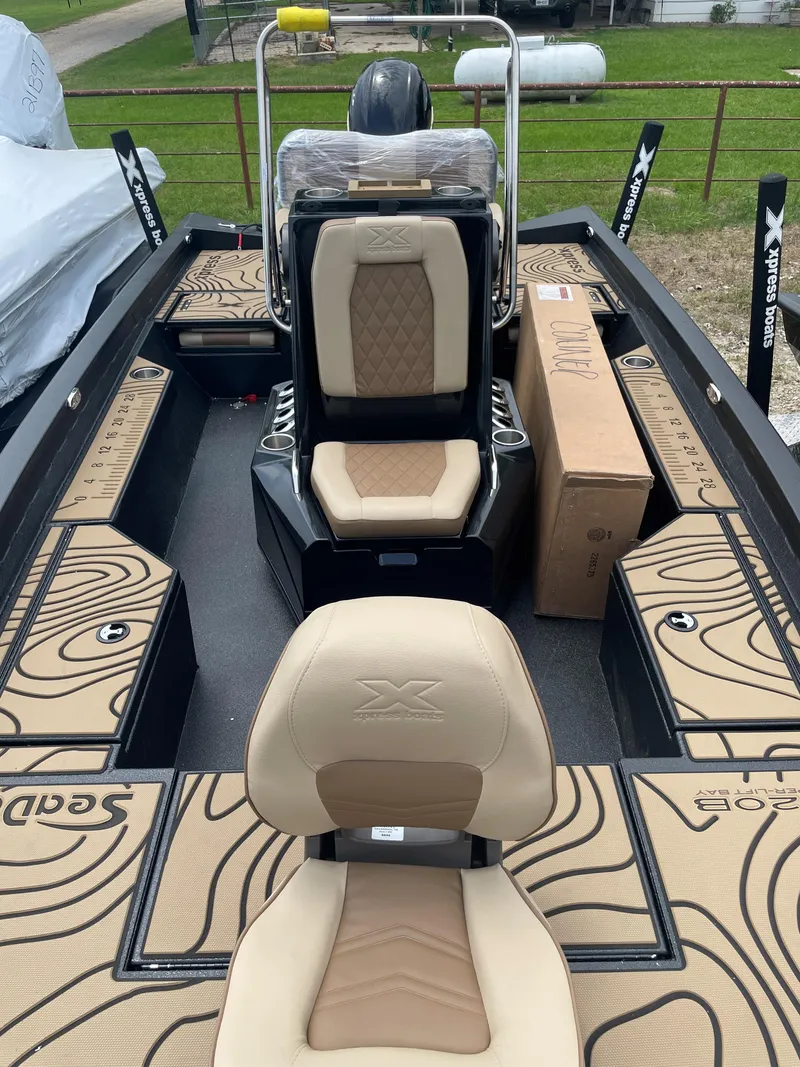 Slide: The Image of 2025 Xpress H20B boat interior with stylish seating and modern design. - 2