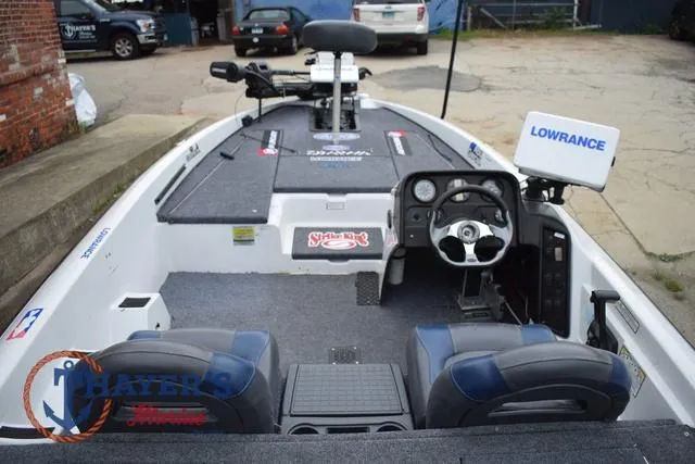 Slide: The Image of 1997 Pro Craft 180 boat interior with steering wheel, seats, and Lowrance equipment. - 14
