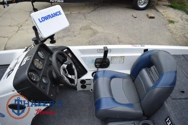 Slide: The Image of 1997 Pro Craft 180 boat interior with steering wheel, gauges, and Lowrance navigation system. - 16