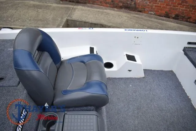 Slide: The Image of 1997 Pro Craft 180 boat interior with blue and gray seating. - 17