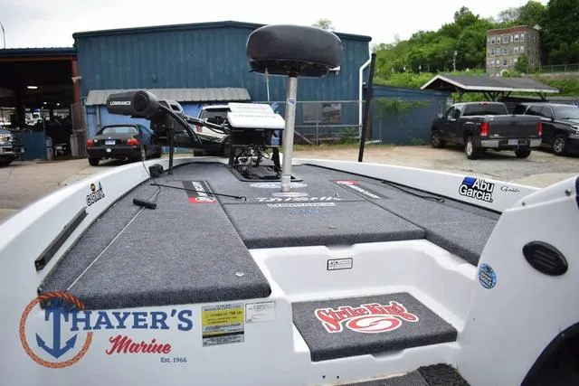 Slide: The Image of 1997 Pro Craft 180 boat deck with fishing gear, Thayer's Marine logo, and Abu Garcia branding. - 19