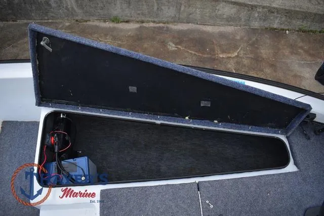 Slide: The Image of Open storage compartment in a 1997 Pro Craft 180 boat, showing interior details. - 21