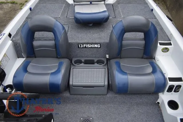 Slide: The Image of Two-tone seats on a 1997 Pro Craft 180 boat with center console and cup holders. - 25
