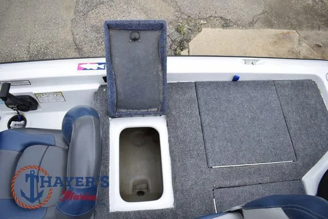 Slide: The Image of 1997 Pro Craft 180 boat interior with storage compartment and seating. - 27