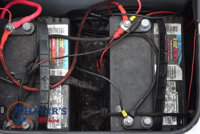 Slide: The Image of Two EverStart batteries with red and black cables in a Pro Craft 180 boat. - 31