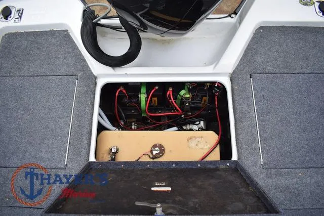 Slide: The Image of 1997 Pro Craft 180 boat interior showing engine compartment with wiring and components. - 32