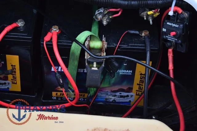 Slide: The Image of Battery setup in a 1997 Pro Craft 180 boat with wiring and connections. - 34