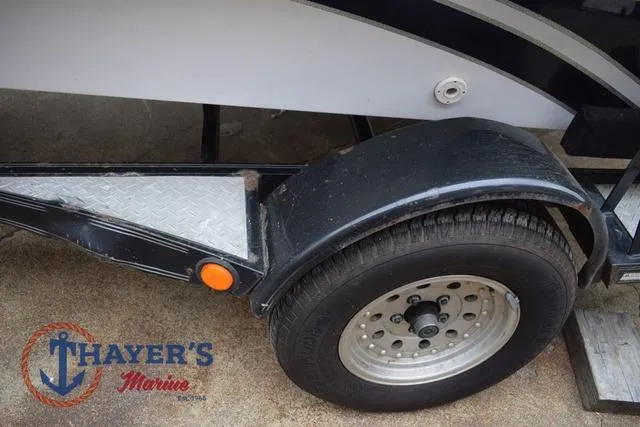 Slide: The Image of Trailer wheel of 1997 Pro Craft 180 boat by Thayer's Marine. - 36