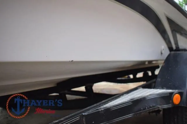 Slide: The Image of 1997 Pro Craft 180 boat on trailer, side view, Thayer's Marine logo visible. - 37