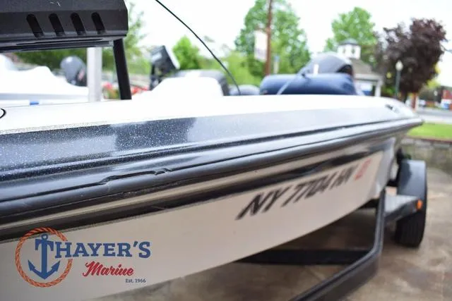 Slide: The Image of 1997 Pro Craft 180 boat at Thayer's Marine, side view with visible registration number. - 38