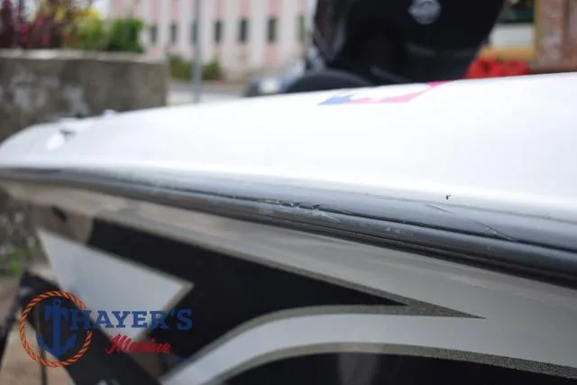 Slide: The Image of 1997 Pro Craft 180 boat with visible wear on the hull, Thayer's Marine logo. - 39