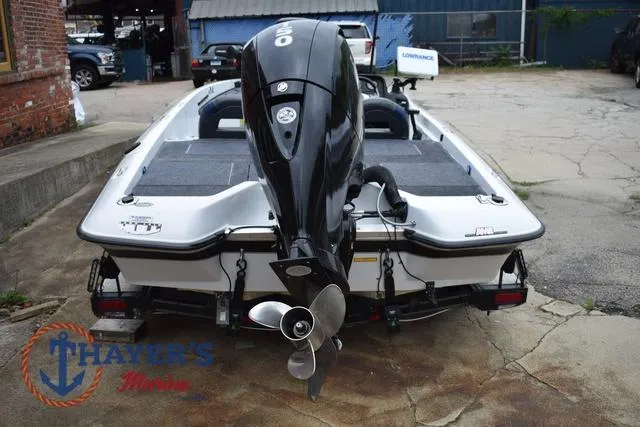 Slide: The Image of 1997 Pro Craft 180 boat with outboard motor, parked on concrete, Thayer's Marine logo visible. - 4