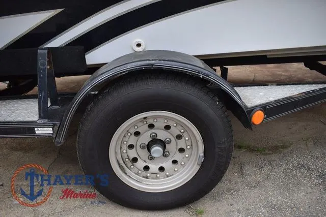 Slide: The Image of Trailer wheel of a 1997 Pro Craft 180 boat at Thayer's Marine. - 40