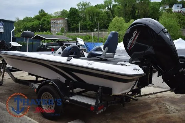 Slide: The Image of 1997 Pro Craft 180 boat with Mercury engine on trailer, parked outdoors. - 5
