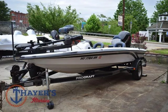 Slide: The Image of 1997 Pro Craft 180 boat on trailer at Thayer's Marine dealership. - 6